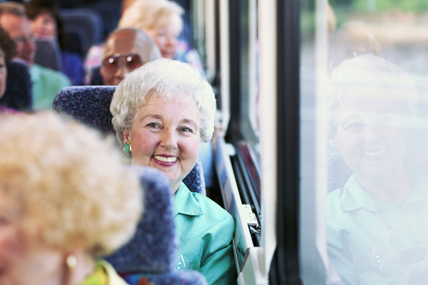 Older lady on bus smiling